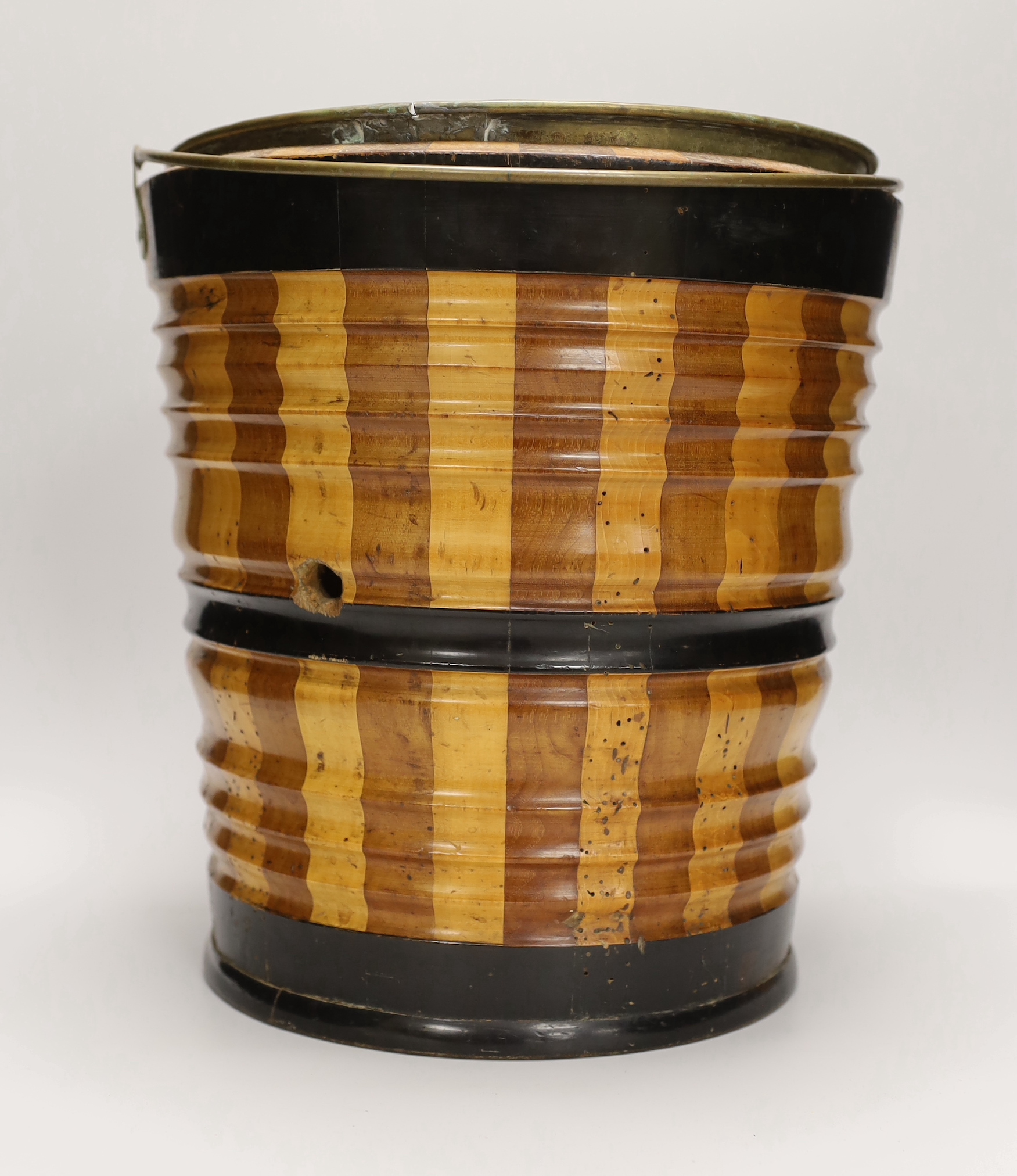 A 19th century Dutch maple and walnut oyster bucket or jardiniere with later brass liner, 32cm high